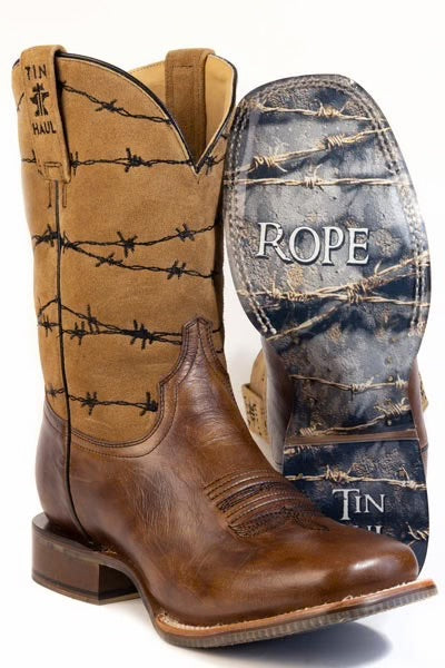 A pair of western boots on a white background, showing the tan leather shaft with black barbed wire print and the brown leather foot, alongside a boot turned to show the dark sole with 'ROPE' branding.